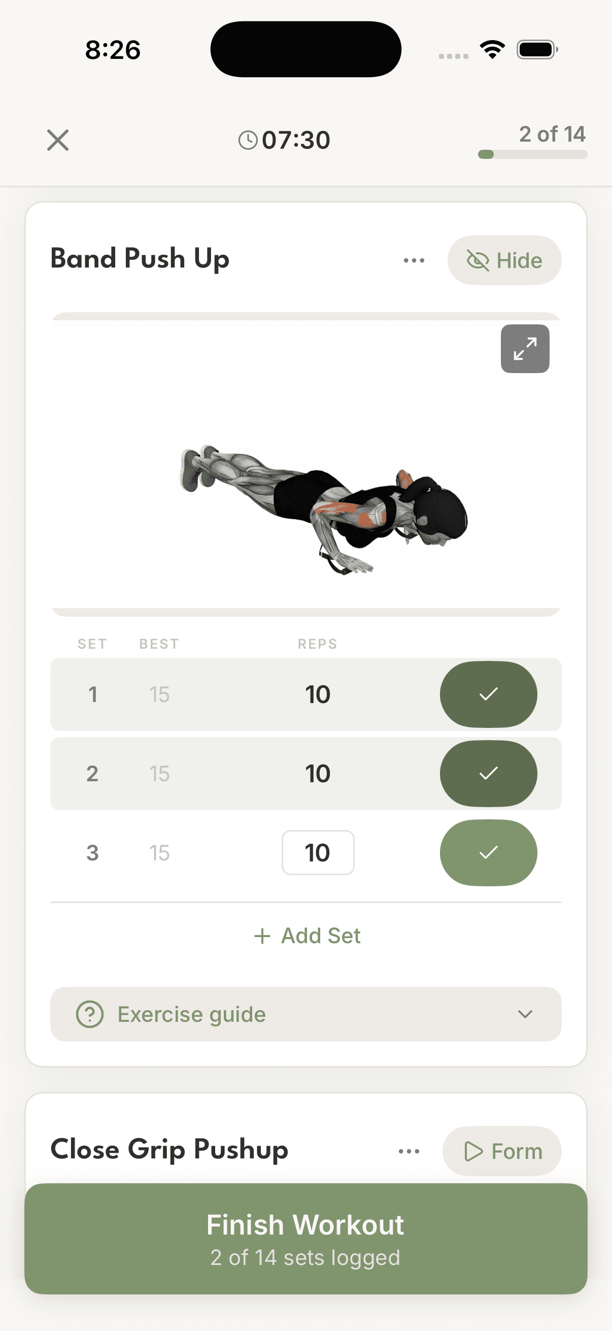 Active workout screen showing Band Push Up with exercise animation, logged sets, and Finish Workout button